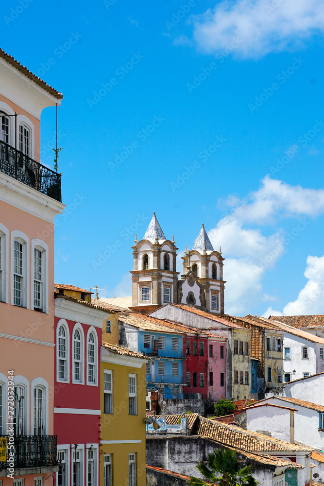 Colorful historic district of Pelourinho with cathedral on the background. The historic center of Salvador, Bahia, Brazil. Historic neighborhood famous attraction for tourist sightseeing. 