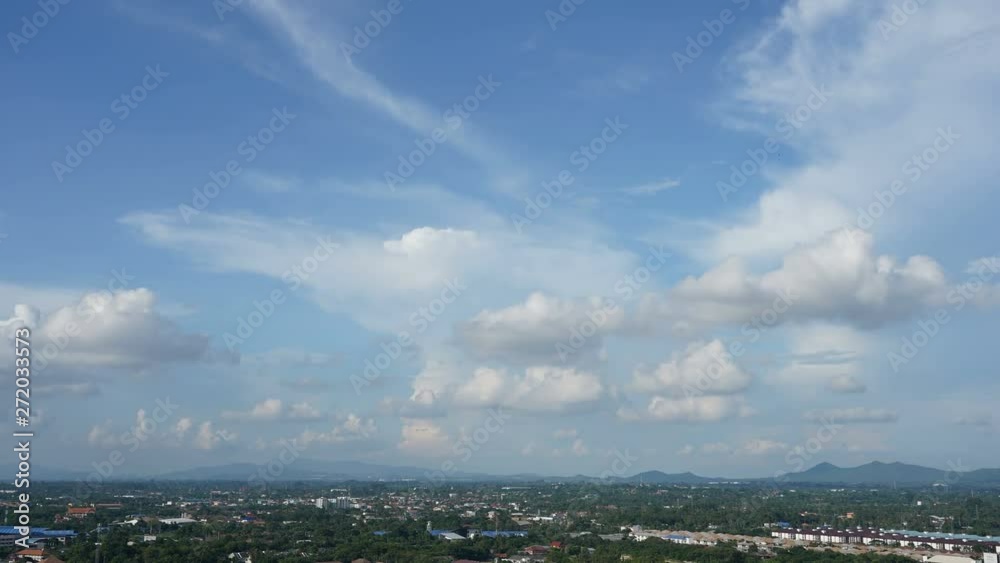 locked wide panoramic time lapse shot of white cumulus clouds and shelf cloud formations forming on a blue sky over Pattayas coastal urban area, copy space and backgrund title plate shot locked wide panoramic time lapse shot of white cumulus clouds and shelf cloud formations forming on a blue sky over Pattayas coastal urban area, copy space and backgrund title plate shot