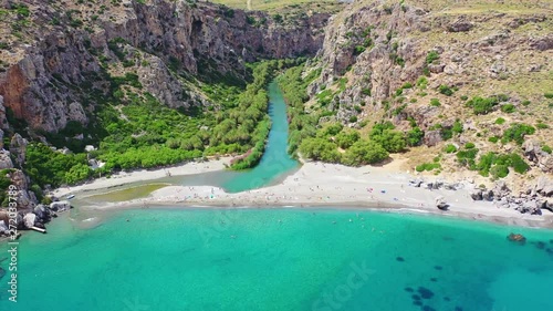 Aerial drone video of Preveli paradise palm beach and lagoon with Palm trees in the South from city of Rethymno, Crete, Greece photo