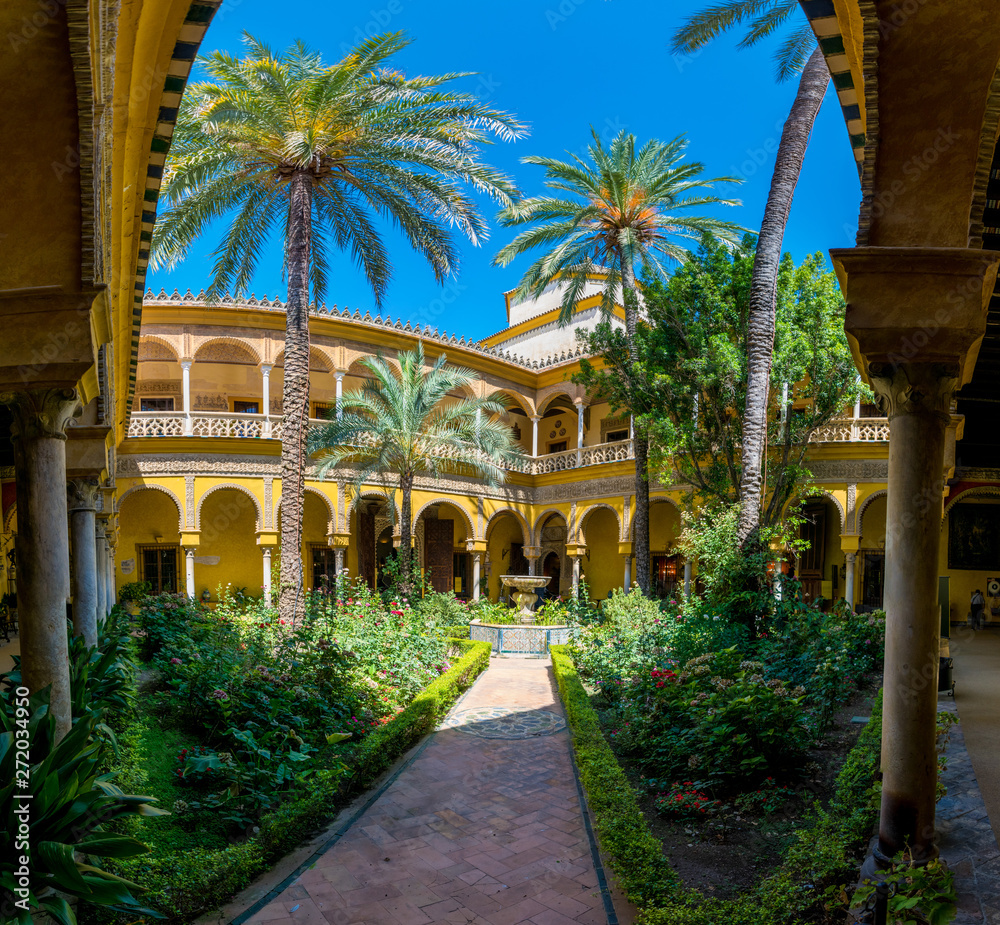 Fototapeta premium A patio from the traditional Andalusian Palacio de las Duenas located in Sevilla, Spain