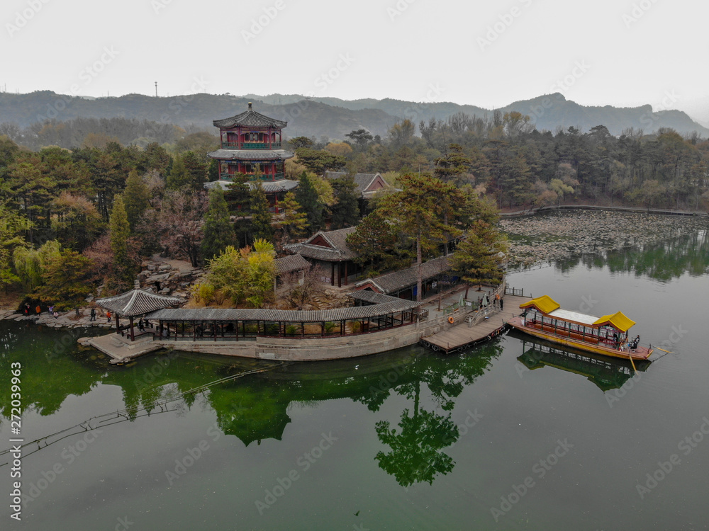 Aerial view little pavilions next the lake inside the Imperial Summer Palace of The Mountain Resort in Chengde. China. Chinese ancient building with lake and old style boat. UNESCO World Heritage. Aerial view little pavilions next the lake inside the Imperial Summer Palace of The Mountain Resort in Chengde. China. Chinese ancient building with lake and old style boat. UNESCO World Heritage.