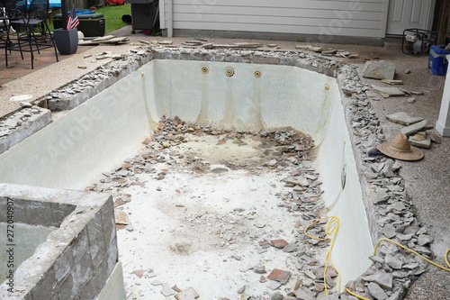 Empty swimming pool after demolishing old tile and coping for remodel