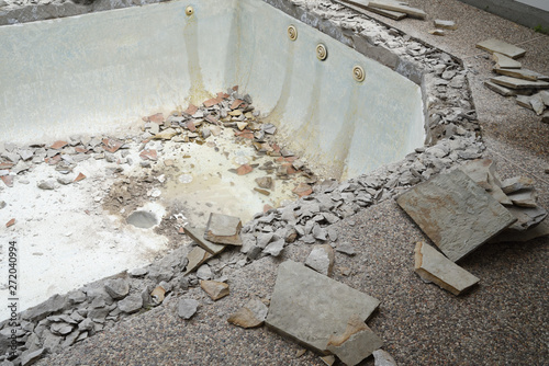 Empty swimming pool after demolishing old tile and coping for remodel