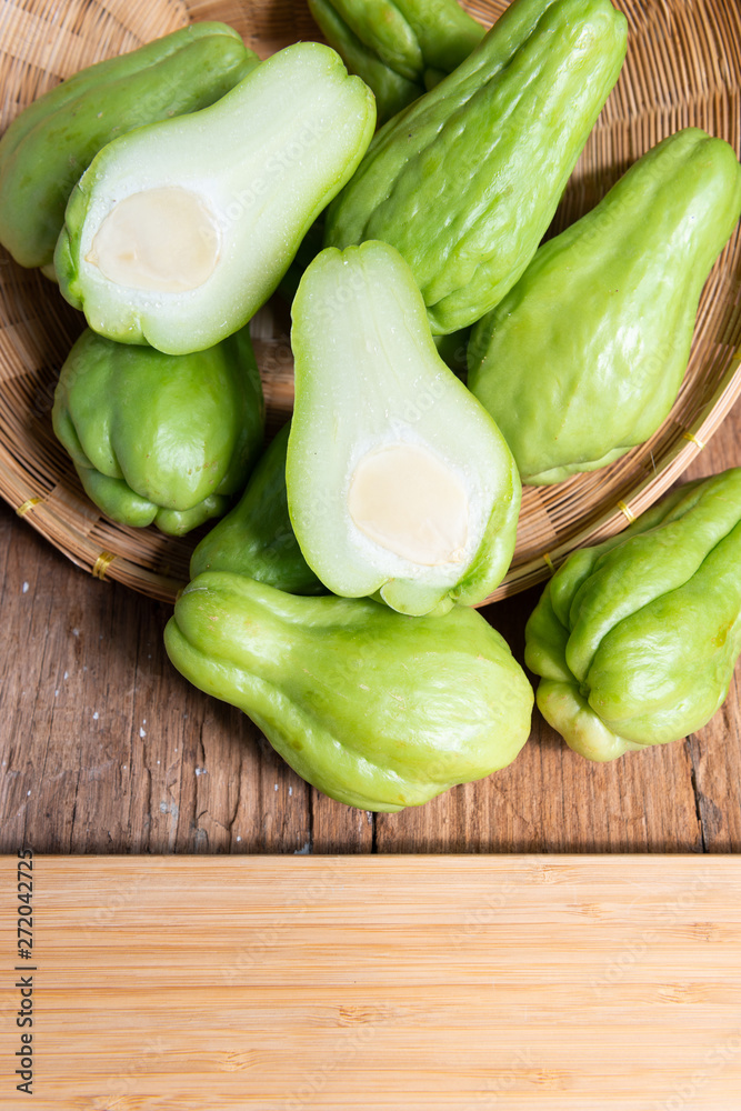 Fresh chayote fruits (Sechium edulis) on wood background Fresh chayote fruits (Sechium edulis) on wood background
