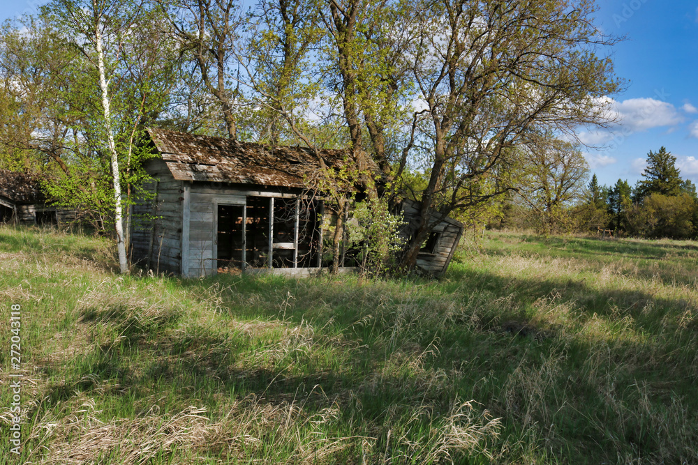 An old abandoned wooden house on the prairies An old abandoned wooden house on the prairies