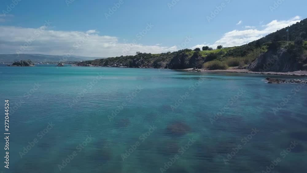 drone is flying over beautiful turquoise sea water and picturesque shore in summer day drone is flying over beautiful turquoise sea water and picturesque shore in summer day