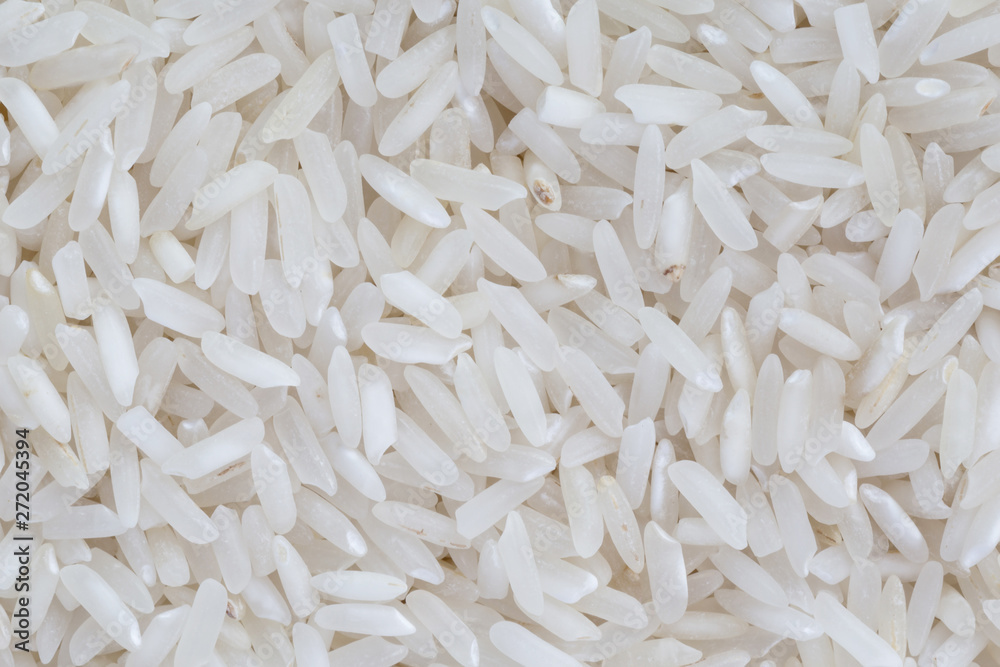 close up of uncooked rice grains background close up of uncooked rice grains background