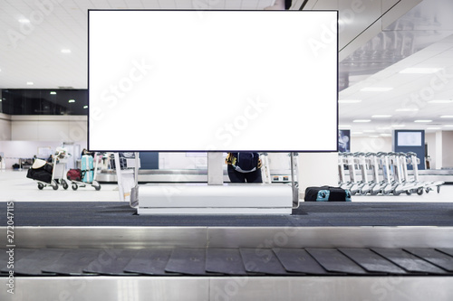 Fototapeta Naklejka Na Ścianę i Meble -  Blank advertising billboard at conveyor belt luggage in airportat airport. Copy space for cutomer text information advertise about tourism transport business etc.
