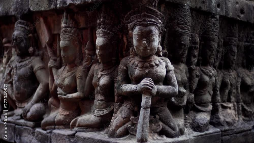 Close view of amazingly detailed bas-reliefs of the Leper King terrace located in the northwest corner of the Royal Square of Angkor Thom, Cambodia. Close view of amazingly detailed bas-reliefs of the Leper King terrace located in the northwest corner of the Royal Square of Angkor Thom, Cambodia.