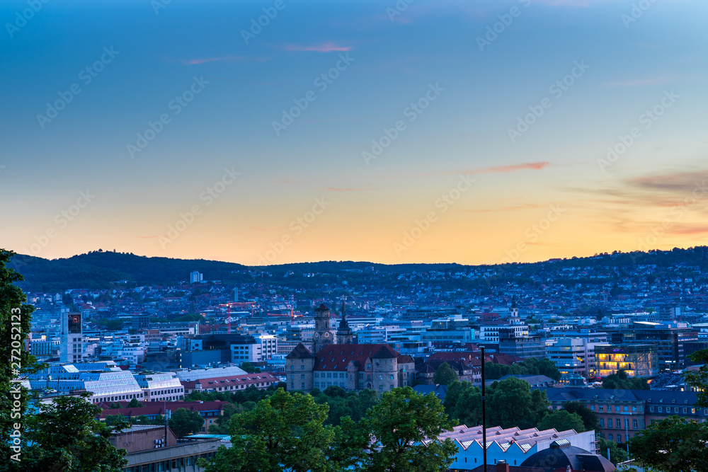 Skyline of downtown stuttgart city centre after sunset from above eugensplatz viewpoint in summer