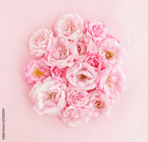Fototapeta Naklejka Na Ścianę i Meble -  Flowers composition background. beautiful pale pink roses bouquet on pale pink background.Top view.Copy space