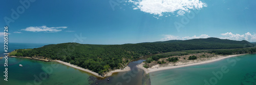 Panoramic aerial drone view of river flowing into the sea. Ropotamo river, Bulgaria