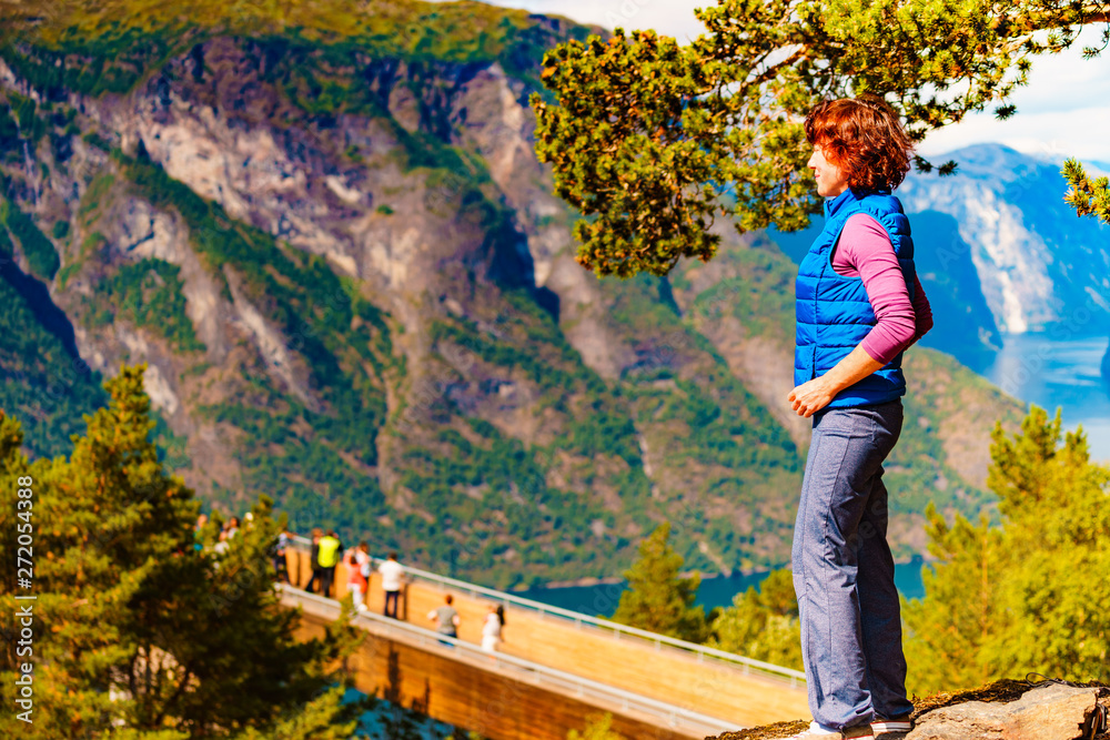 Naklejka premium Tourist enjoying mountains fjord view, Norway