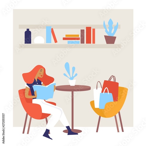 Woman at cafe reading menu after shopping with bags and packs