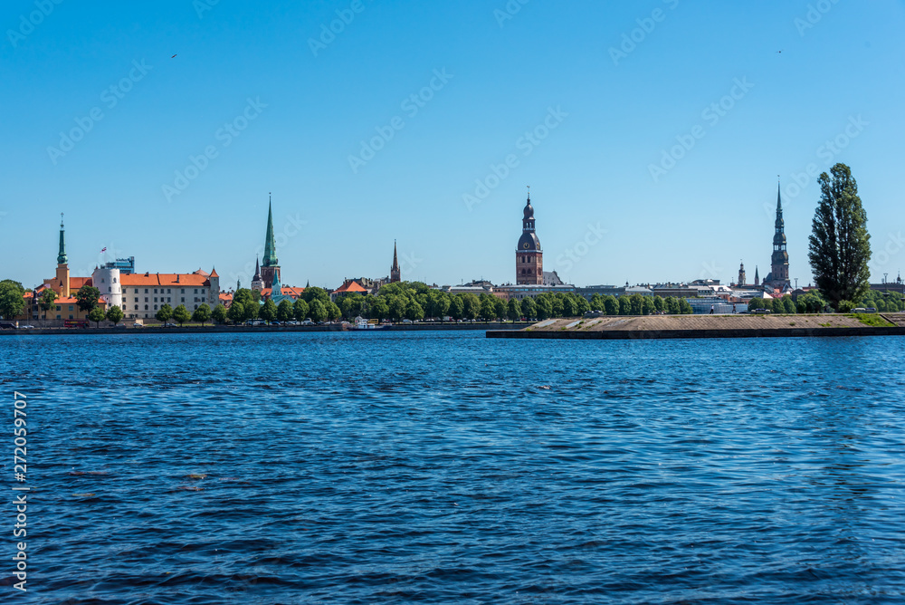 Fototapeta premium Cityscape of River and Riga Latvia on a Clear Sunny Day