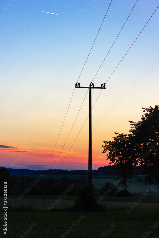 telegraph pole at colorful sunset