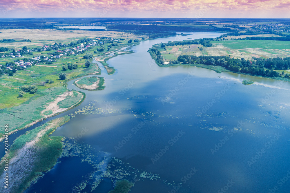 Aerial view of the river. Rural landscape in summer