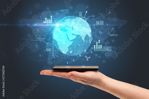Hand using phone with multinational worldwide estate report concept
