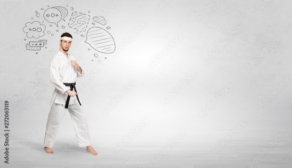 Young kung-fu trainer fighting with doodled symbols concept

