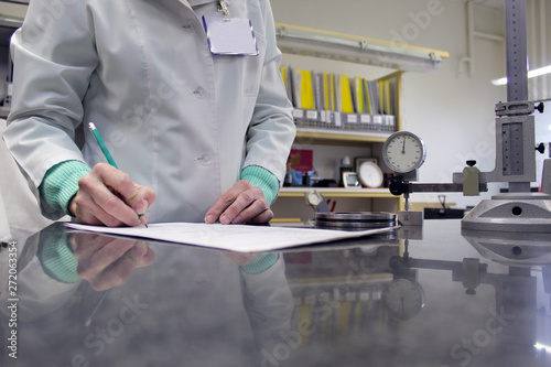 woman makes the metrological measurements