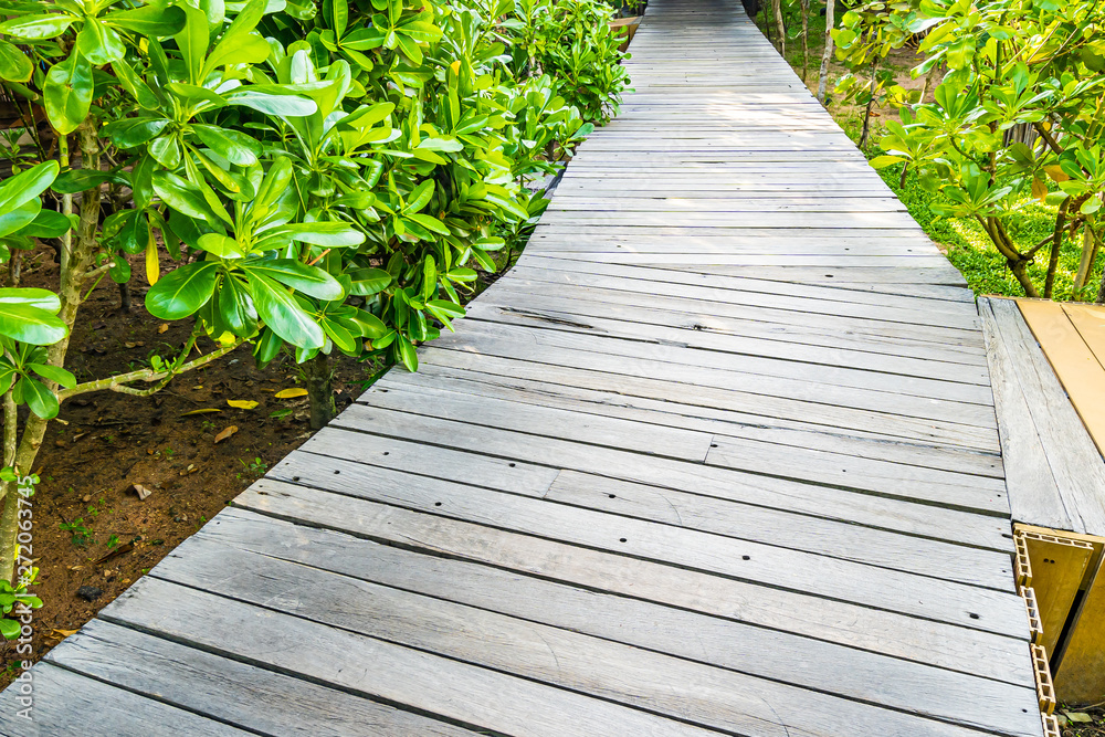 Beautiful wooden path walk in the garden Beautiful wooden path walk in the garden