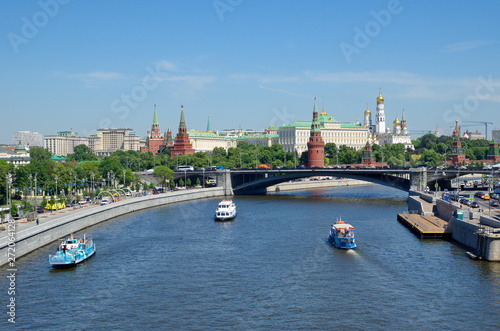Summer view of the Moscow Kremlin, Prechistenskaya, Bersenevskaya embankments and pleasure boats. Moscow, Russia © koromelena