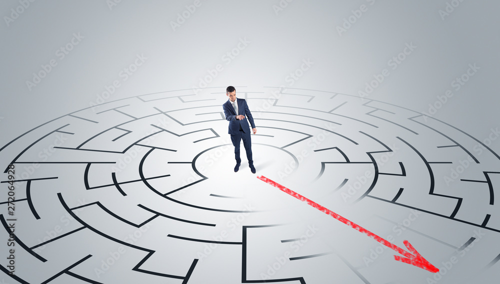 Businessman going through the maze with red arrow
Businessman going through the maze with red arrow