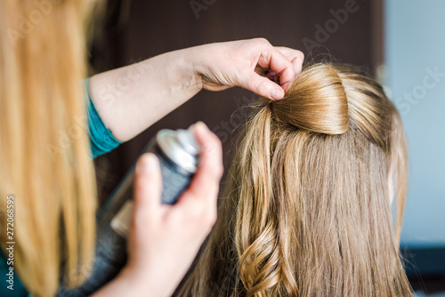 A WOMAN GETTING A HAIR DO BY A PROFFESIONAL HAIRDRESSER