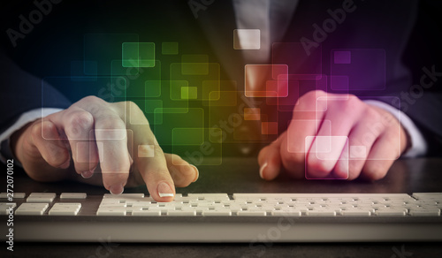 Business woman typing on keyboard with colorful concept
