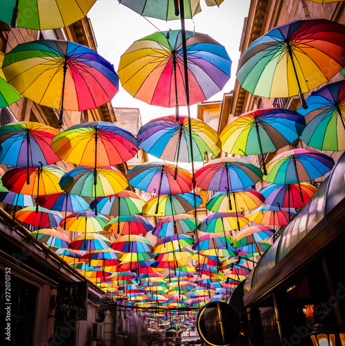 Colorful umbrellas in the sky of the Victoria Passage, in Bucharest city centre, Romania