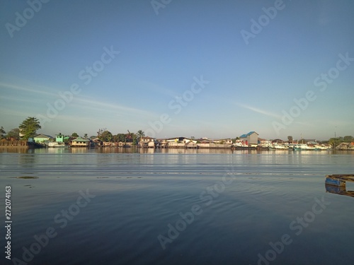 the scenery in river with the sky blue