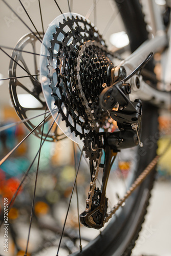Mountain cycle in sports shop, focus on rear wheel