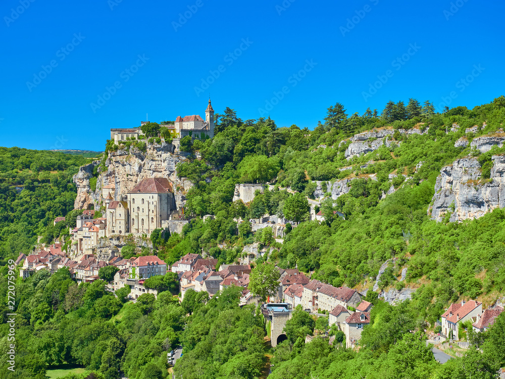 Foreground landscape view of the Dordogne tributary river valley cliff with the medieval french village of Rocamadour, Lot Department, Quercy, Occitanie Region, France. UNESCO world heritage site.