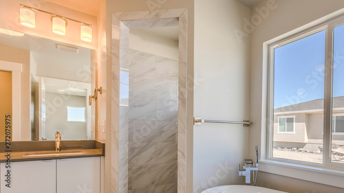 Panorama frame Bathroom interior with bathtub glass door shower and vanity area