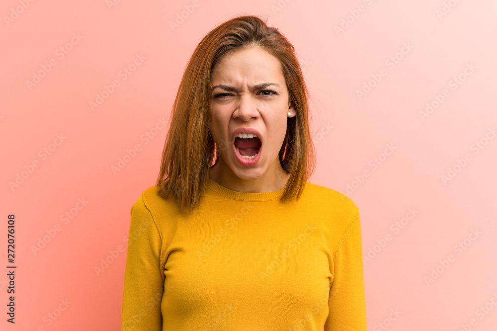 Young pretty young woman screaming very angry and aggressive. Young pretty young woman screaming very angry and aggressive.