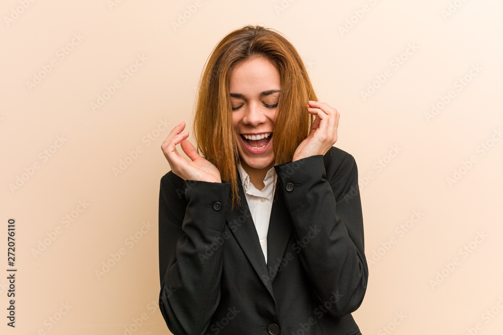Young caucasian business woman joyful laughing a lot. Happiness concept. Young caucasian business woman joyful laughing a lot. Happiness concept.