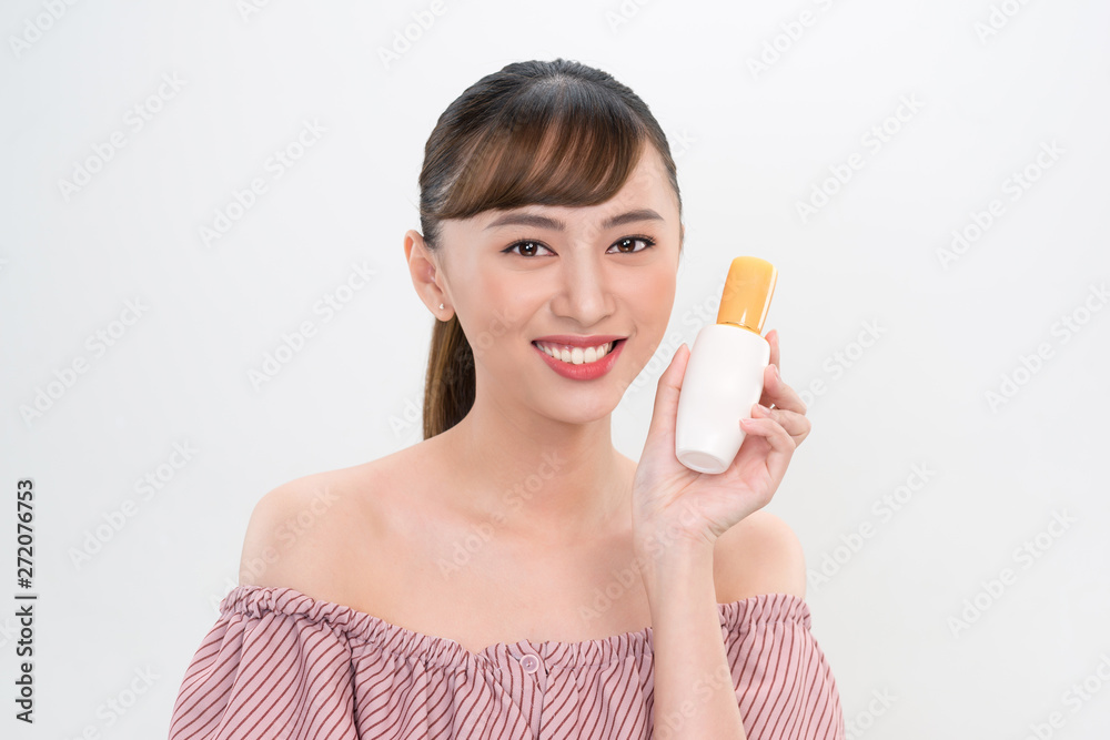 asian woman showing cream on her hand, isolated on white asian woman showing cream on her hand, isolated on white