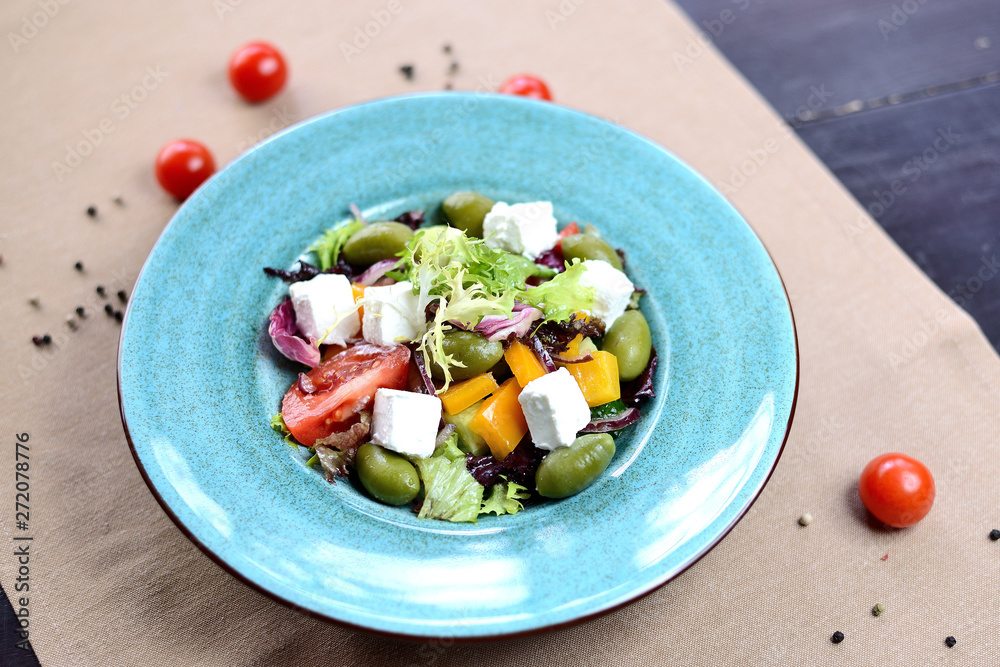Greek salad. Salad with feta cheese, olives, cherry tomatoes and bell peppers