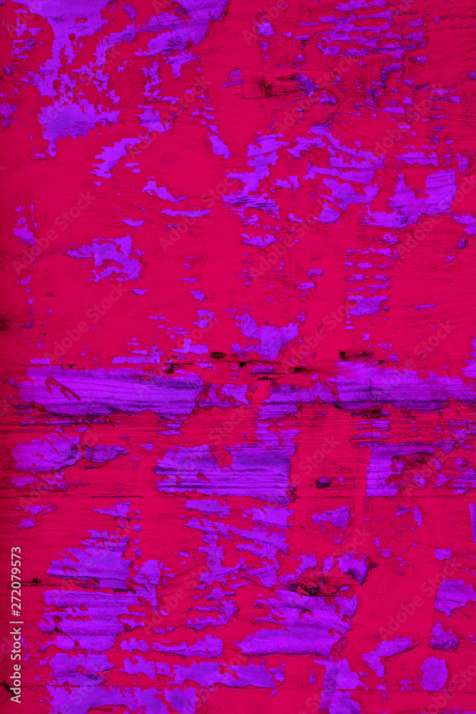Background image of close up peeled red and purple color textured wooden building exterior surface