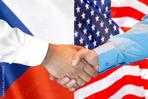 Business handshake on the background of two flags. Men handshake on the background of the Czech Republic and United States of America flag. Support concept