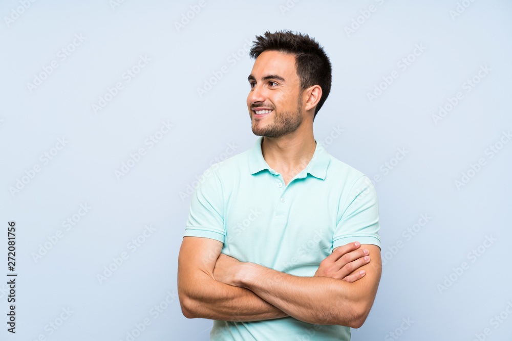 Handsome young man over isolated background happy and smiling