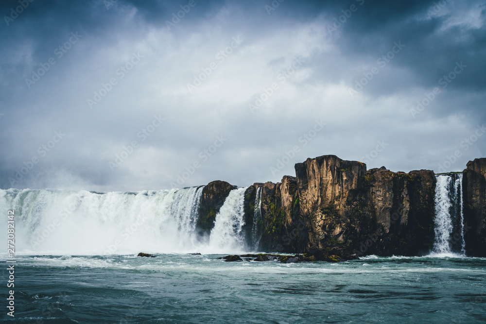 Godafoss waterfall in Iceland with cloudy sky Godafoss waterfall in Iceland with cloudy sky