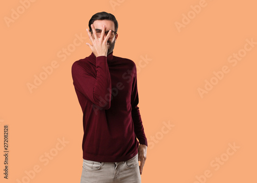 Young natural man feels worried and scared