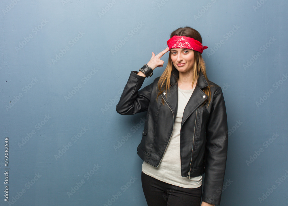 Young russian woman doing a suicide gesture