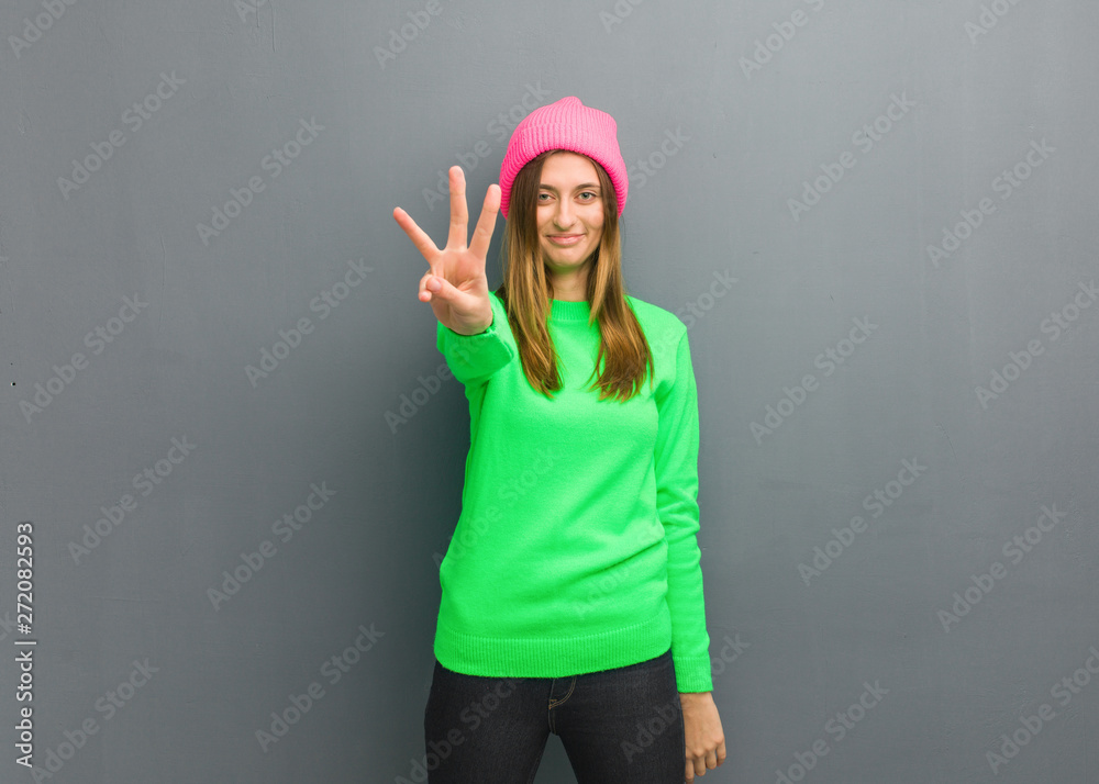 Young natural russian girl showing number three Young natural russian girl showing number three