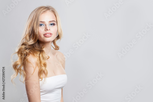 Portrait of cute young woman with blonde hair