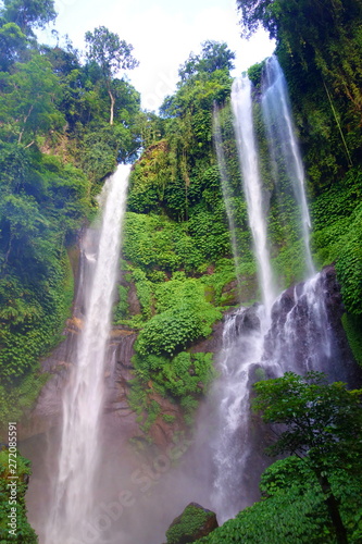 Sekumpul waterfall in Bali surrounded by tropical forest, Indonesia