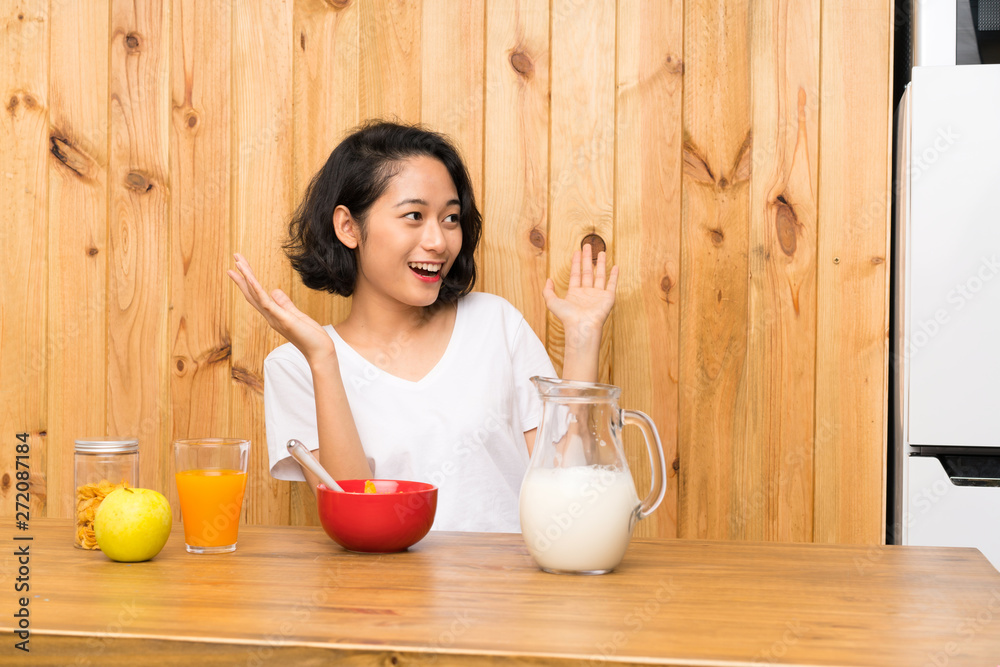 Asian young woman having breakfast milk with surprise facial expression Asian young woman having breakfast milk with surprise facial expression