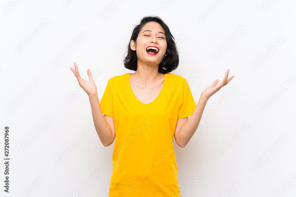 Asian young woman over isolated white background smiling a lot Asian young woman over isolated white background smiling a lot
