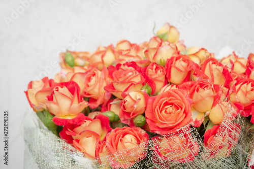 Large beautiful bouquet of orange roses in the package © Viktoriya09